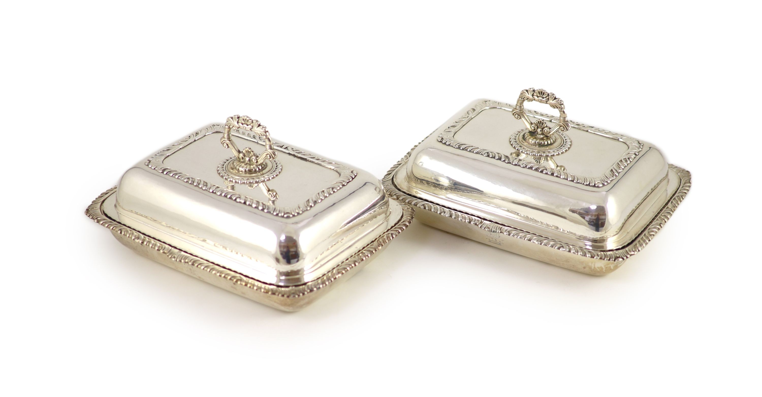 A pair of George III silver entrée dishes and covers, James Kirkby, Waterhouse & Co, Sheffield